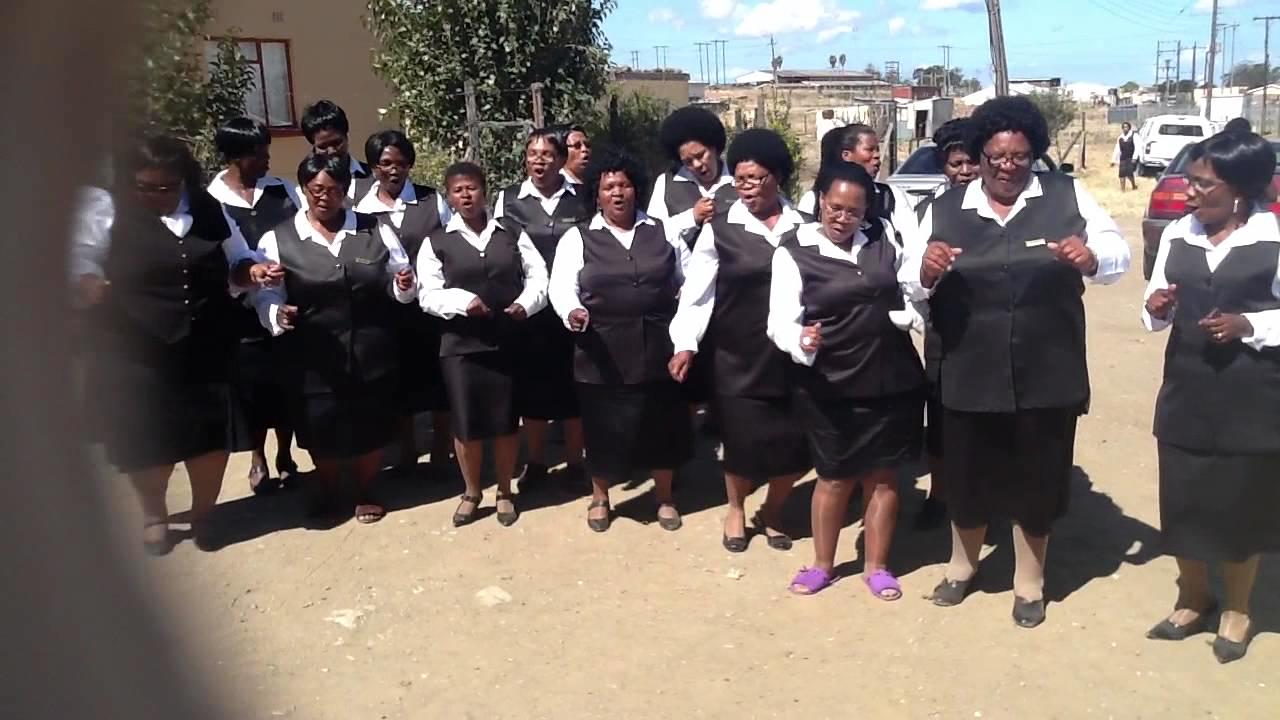 Members of the congregation in church uniform